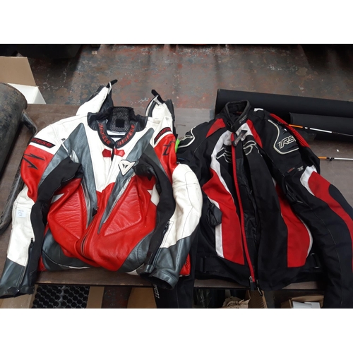 185 - TWO ITEMS TO INCLUDE A MULTICOLOURED LEATHER DAINESE MOTORCYCLE SUIT AND A BLACK, RED AND WHITE RST ... 