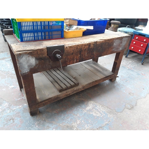 209 - A VINTAGE WOODEN WORKSHOP BENCH MEASURING APPROX 5' X 2' X 32