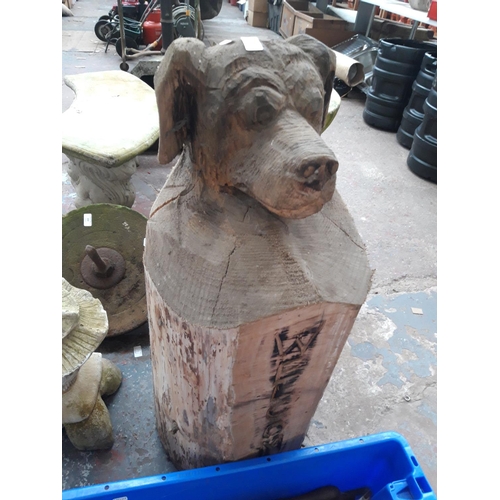 213 - A CARVED WOODEN DOG WELCOME POST