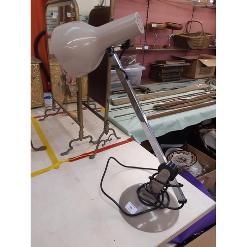 554 - A RETRO STYLE BROWN METAL AND CHROME ARTICULATED DESK LAMP