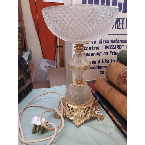 560 - AN ANTIQUE STYLE GLASS AND GILT METAL TABLE LAMP