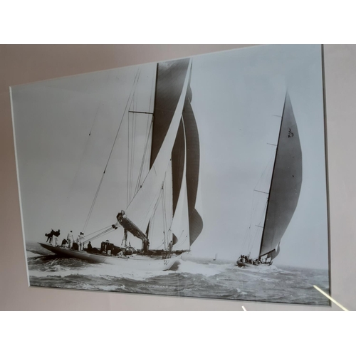 723 - THREE WALNUT FRAMED NAUTICAL BLACK AND WHITE PHOTOGRAPHS TOGETHER WITH A SKETCH OF A HARBOUR SCENE B... 