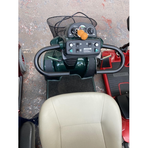 31 - A CRAFTMATIC COMFORT COACH IV GREEN MOBILITY SCOOTER WITH KEY AND CHARGER CABLE