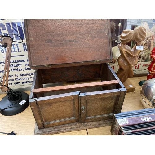 568 - A VINTAGE OAK BOX WITH TWO LOWER DOORS (IN NEED OF ATTENTION)