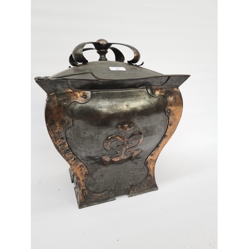 64 - AN ART NOUVEAU COPPER COAL BIN WITH HAND RIVETED SIDES, EMBOSSED CENTRES AND CROWN SHAPED TOP - MEAS... 