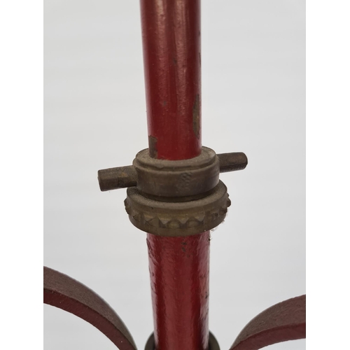 40 - A 20TH CENTURY RED PAINTED WROUGHT IRON STANDARD LAMP ON ELABORATE TRIPOD BASE WITH BRASS DETAILS - ... 