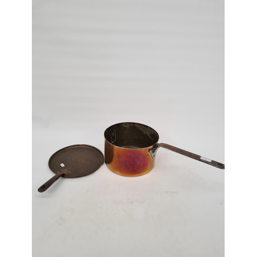 63 - A LARGE ANTIQUE COPPER SAUCEPAN WITH IMPRESSED H.D.P MARK, STEEL HANDLE AND SIMILAR LID WITH F.LAMBE... 