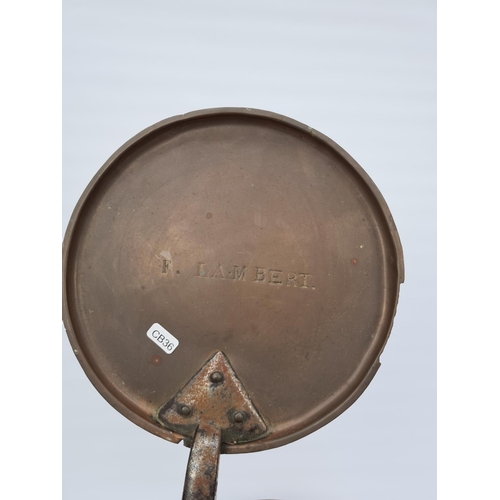 63 - A LARGE ANTIQUE COPPER SAUCEPAN WITH IMPRESSED H.D.P MARK, STEEL HANDLE AND SIMILAR LID WITH F.LAMBE... 