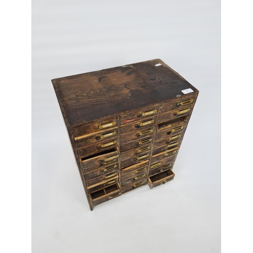 26 - AN EARLY 20TH CENTURY PINE THIRTY DRAWER ENGINEERS/WATCHMAKERS CABINET - MEASURING APPROX. HEIGHT 58... 