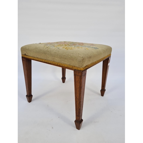 53 - AN EDWARDIAN INLAID OAK FRAMED SQUARE FOOTSTOOL WITH TAPESTRY UPHOLSTERED TOP ON TAPERED SUPPORTS - ... 