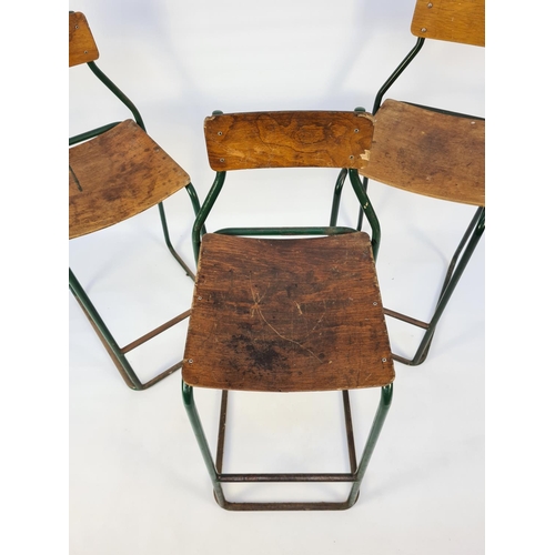 1 - A SET OF THREE 1950'S FACTORY WORK STOOLS WITH GREEN TUBULAR METAL FRAMES AND PLYWOOD SEATS AND BACK... 