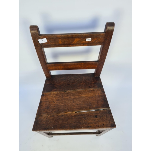 57 - AN 18TH CENTURY OAK COUNTRY SIDE CHAIR WITH LOWER STRETCHERS - MEASURING APPROX. HEIGHT 83CM, WIDTH ... 