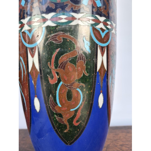 60 - A MATCHING PAIR OF EARLY 20TH CENTURY CLOISONNE VASES WITH SHADES OF BLUES, GREENS, WHITES AND BROWN... 