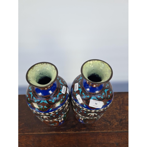 60 - A MATCHING PAIR OF EARLY 20TH CENTURY CLOISONNE VASES WITH SHADES OF BLUES, GREENS, WHITES AND BROWN... 