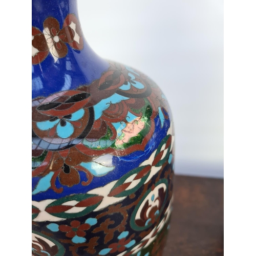 60 - A MATCHING PAIR OF EARLY 20TH CENTURY CLOISONNE VASES WITH SHADES OF BLUES, GREENS, WHITES AND BROWN... 