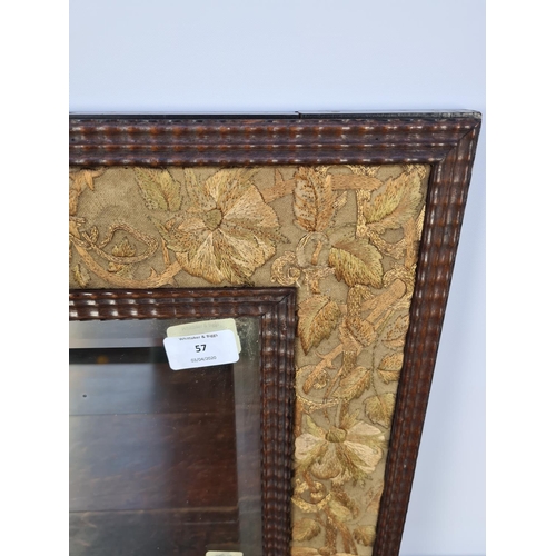 73 - AN UNUSUAL TRAMP ART STYLE WOODEN FRAMED RECTANGULAR MIRROR WITH HAND EMBROIDERED SILK FLORAL BORDER... 