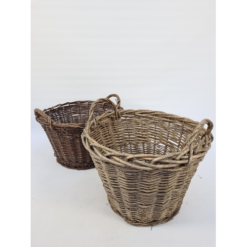 24 - A PAIR OF VINTAGE WICKER LOG BASKETS - TALL EXAMPLE APPROX. HEIGHT 41CM AND DIAMETER 52CM