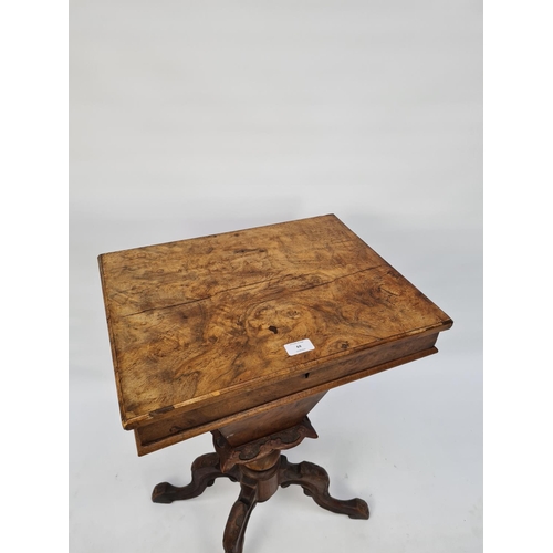 70 - A VICTORIAN HEAVILY CARVED BURR WALNUT SEWING BOX ON QUATREFOIL BASE WITH SECTIONED INTERIOR AND LAT... 