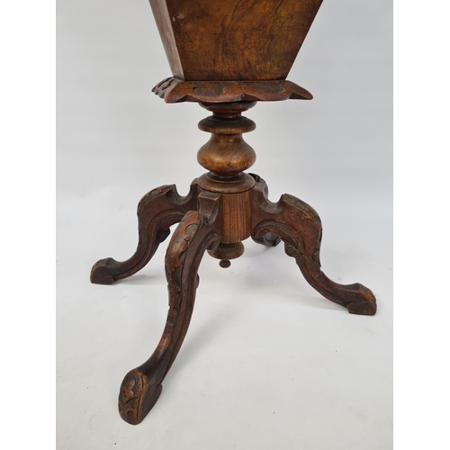 70 - A VICTORIAN HEAVILY CARVED BURR WALNUT SEWING BOX ON QUATREFOIL BASE WITH SECTIONED INTERIOR AND LAT... 