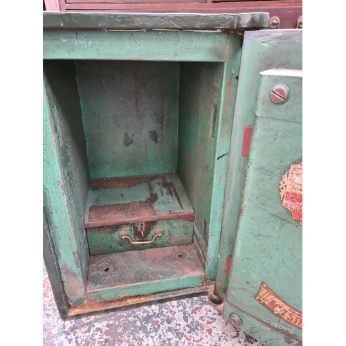 52 - A 19TH CENTURY T.WITHERS & SONS LTD. OF WEST BROMWICH GREEN PAINTED CAST IRON SAFE WITH KEY - MEASUR... 