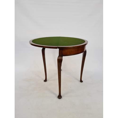 54 - A BURR WALNUT QUEEN ANNE STYLE FOUR LEGGED HALF MOON HALL/CARD TABLE WITH GREEN BAIZE TOP, CONCEALED... 