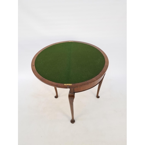 54 - A BURR WALNUT QUEEN ANNE STYLE FOUR LEGGED HALF MOON HALL/CARD TABLE WITH GREEN BAIZE TOP, CONCEALED... 