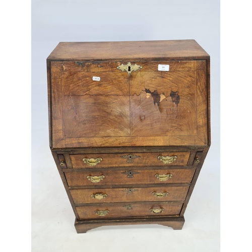 29 - A GEORGIAN WALNUT BUREAU WITH FOUR DRAWERS, BRASS HANDLES, BRASS ESCUTCHEONS AND BRACKET FEET - MEAS... 