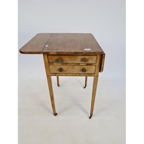 13 - AN EDWARDIAN SATINWOOD AND WALNUT DROP LEAF WORK TABLE WITH TWO DRAWERS, TWO FREIZE DRAWERS, CIRCULA... 