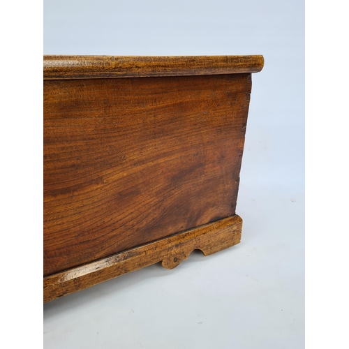 75 - A VICTORIAN PINE BLANKET BOX ON BRACKET FEET WITH BRASS ESCUTCHEON, REPLACED BRASS HANDLES AND INNER... 