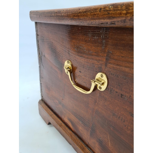 75 - A VICTORIAN PINE BLANKET BOX ON BRACKET FEET WITH BRASS ESCUTCHEON, REPLACED BRASS HANDLES AND INNER... 