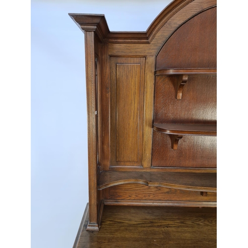 61 - AN ART NOUVEAU CARVED OAK DRESSER WITH TWO LOWER DOORS, TWO DRAWERS WITH EXCELLENT QUALITY ORIGINAL ... 