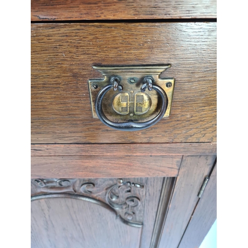 61 - AN ART NOUVEAU CARVED OAK DRESSER WITH TWO LOWER DOORS, TWO DRAWERS WITH EXCELLENT QUALITY ORIGINAL ... 