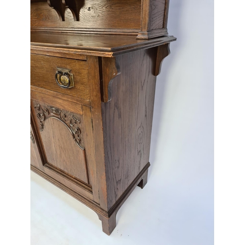 61 - AN ART NOUVEAU CARVED OAK DRESSER WITH TWO LOWER DOORS, TWO DRAWERS WITH EXCELLENT QUALITY ORIGINAL ... 