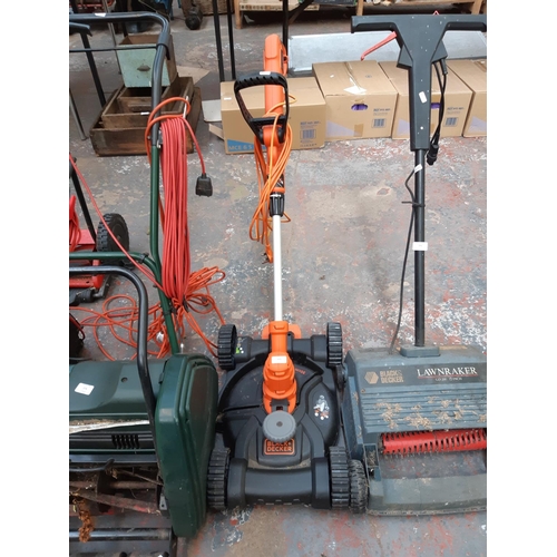 375 - A BLACK AND ORANGE BLACK AND DECKER 30CM FOUR WHEELED STRIMMER