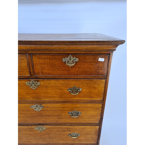 10 - AN IMPRESSIVE GEORGIAN OAK CHEST OF TWO SHORT OVER FOUR LONG DRAWERS WITH UNUSUAL BRASS ORIENTAL INF... 