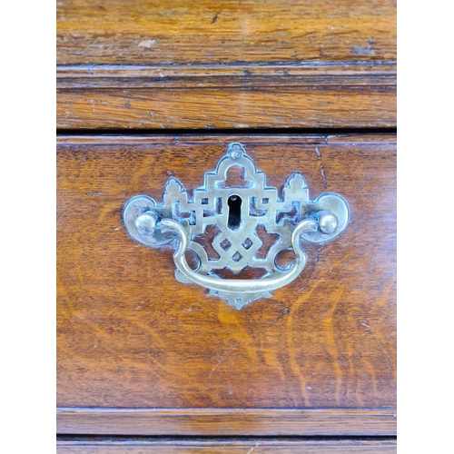 10 - AN IMPRESSIVE GEORGIAN OAK CHEST OF TWO SHORT OVER FOUR LONG DRAWERS WITH UNUSUAL BRASS ORIENTAL INF... 