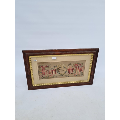 62 - A 19TH CENTURY OAK FRAMED FORGET ME NOT SAMPLER