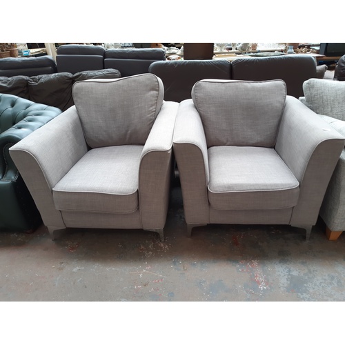 773 - A MATCHING PAIR OF GREY UPHOLSTERED ARMCHAIRS