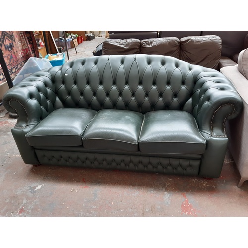 774 - A CHESTERFIELD STYLE GREEN LEATHER THREE SEATER SOFA