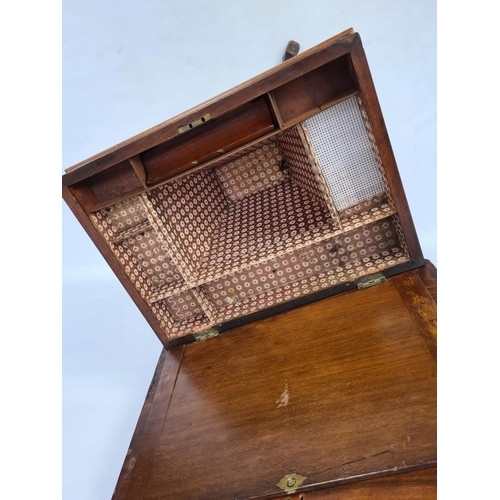 70 - A VICTORIAN HEAVILY CARVED BURR WALNUT SEWING BOX ON QUATREFOIL BASE WITH SECTIONED INTERIOR AND LAT... 