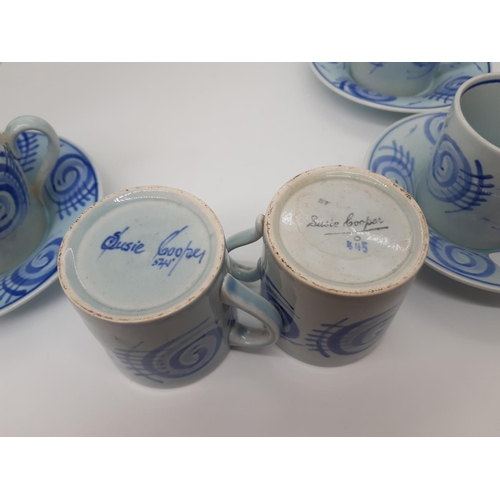 185 - A SET OF FIVE HAND PAINTED SUSIE COOPER COFFEE CUPS AND SAUCERS