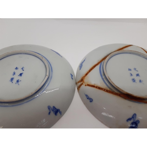 192 - A PAIR OF EARLY 20TH CENTURY CHINESE PLATES WITH STYLISED PEACOCK DESIGN AND SIX CHARACTER MARKED BA... 