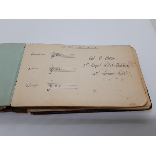 76 - A UNIQUE WW1 PERIOD AUTOGRAPH ALBUM CONTAINING PERSONAL MESSAGES, GREETINGS, JOKES, SKETCHES AND MUS... 