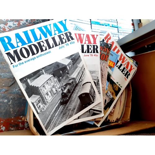 409 - A BOX CONTAINING A LARGE QUANTITY OF MODEL RAILWAY MAGAZINES AND FLORAL CURTAINS