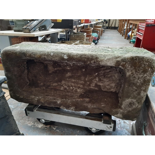 437 - AN 18TH CENTURY HEAVY SANDSTONE TROUGH -MEASURING APPROX. 3'4