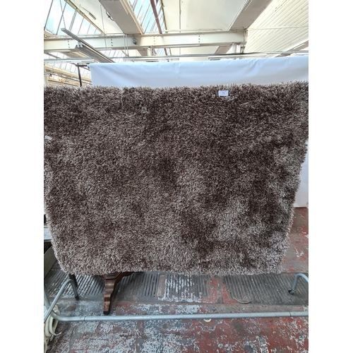 778 - A DUNELM INDULGENT DESIGN MINK BROWN SHAG PILE RUG - MEASURING APPROX. 120 CM X 170 CM