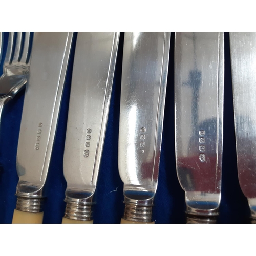 108 - A BURR WALNUT CANTEEN OF CUTLERY WITH HALLMARKED SILVER OF LONDON SIX PLACE FISH KNIFE AND FORK SET ... 