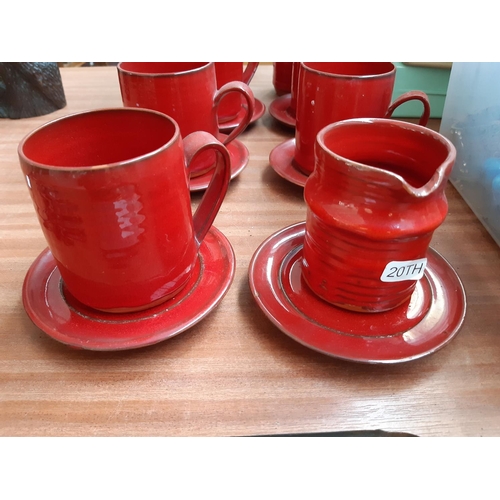 113 - A MID 20TH CENTURY FOURTEEN PIECE STUDIO CERAMIC COFFEE SET WITH RED PAINTED DRIP GLAZED EXTERIOR