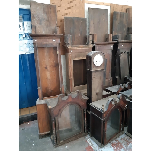 119 - NINE GRANDFATHER CLOCK CASES, TWO GRANDMOTHER CLOCK CASES AND EIGHT GRANDFATHER CLOCK HOODS