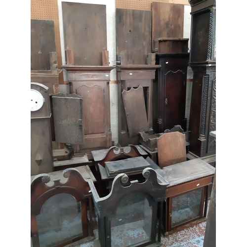 119 - NINE GRANDFATHER CLOCK CASES, TWO GRANDMOTHER CLOCK CASES AND EIGHT GRANDFATHER CLOCK HOODS